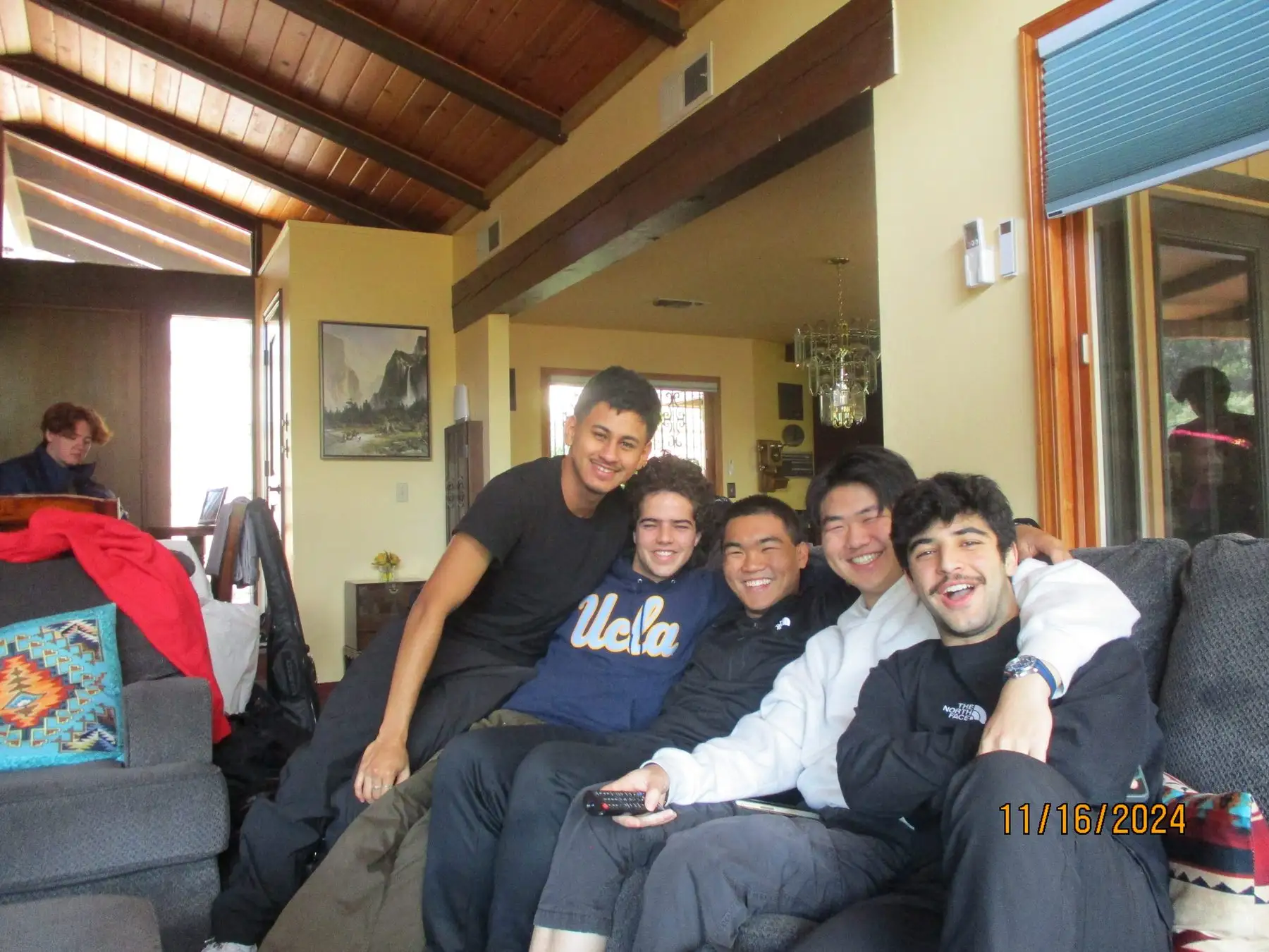 Five brothers on the couch at the retreat cabin