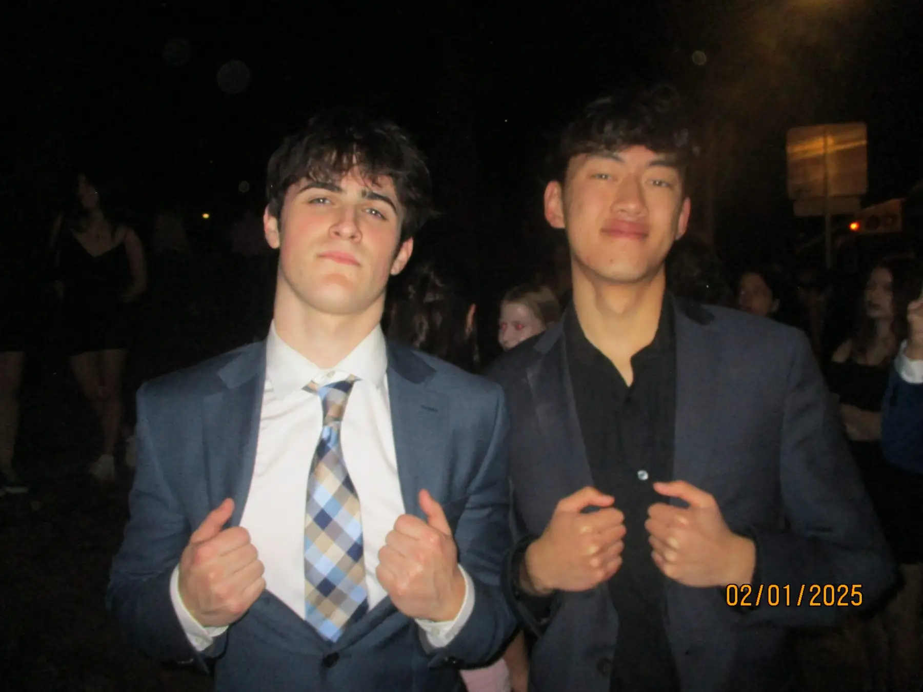 Two brothers in suits before formal