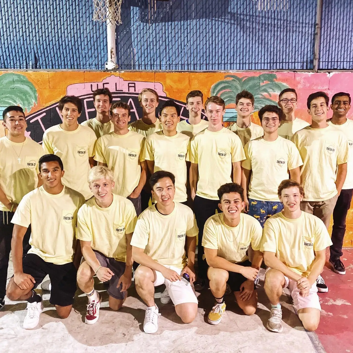 basketball team in letters at mural