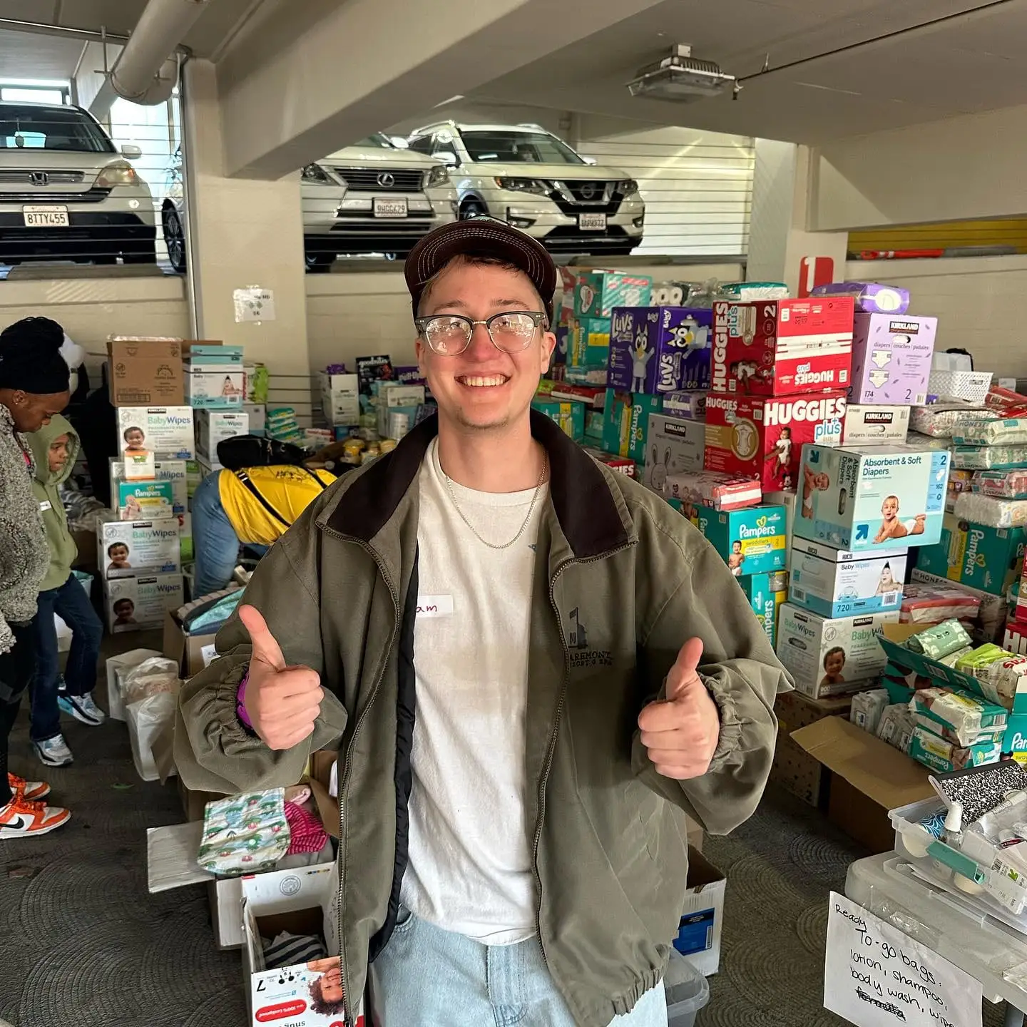 thumbs up amid donation boxes