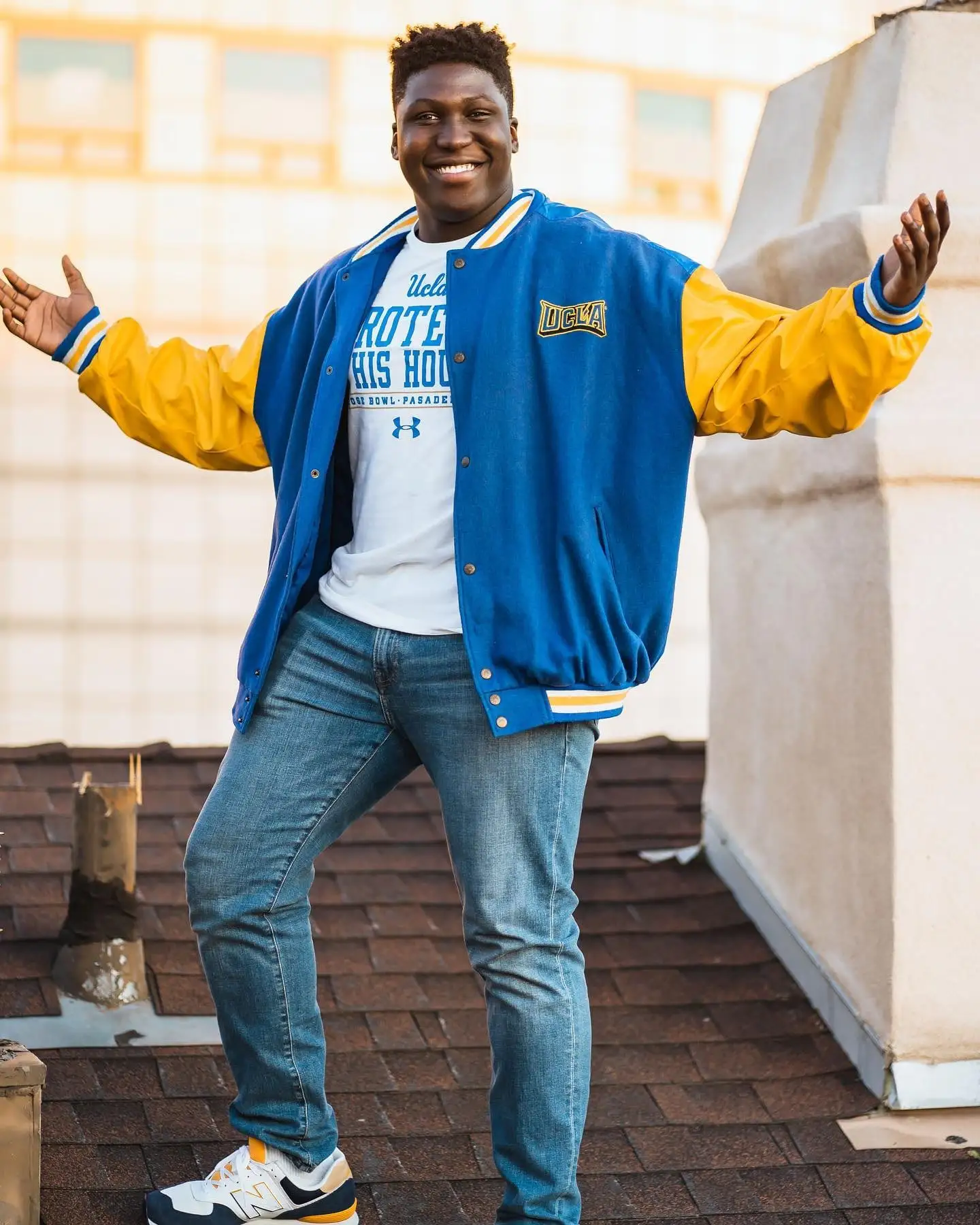 UCLA letterman jacket arms wide