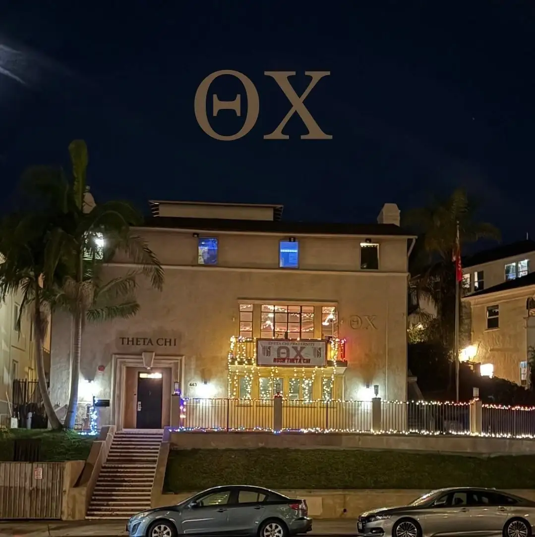chapter house lit up at night with letters