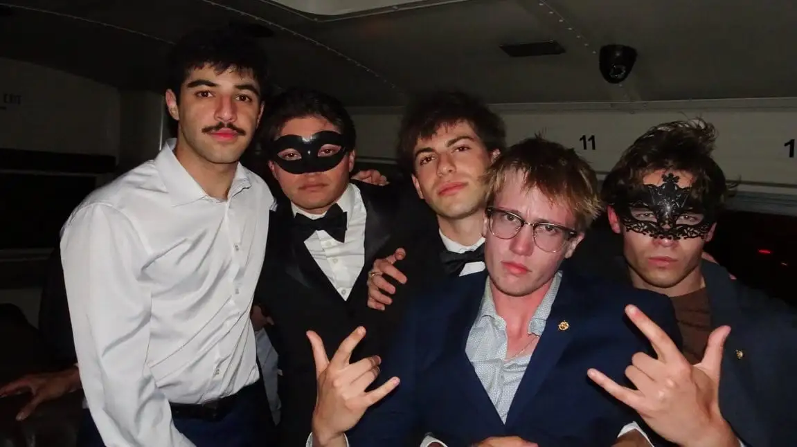 The masquerade formal group in masks and suits
