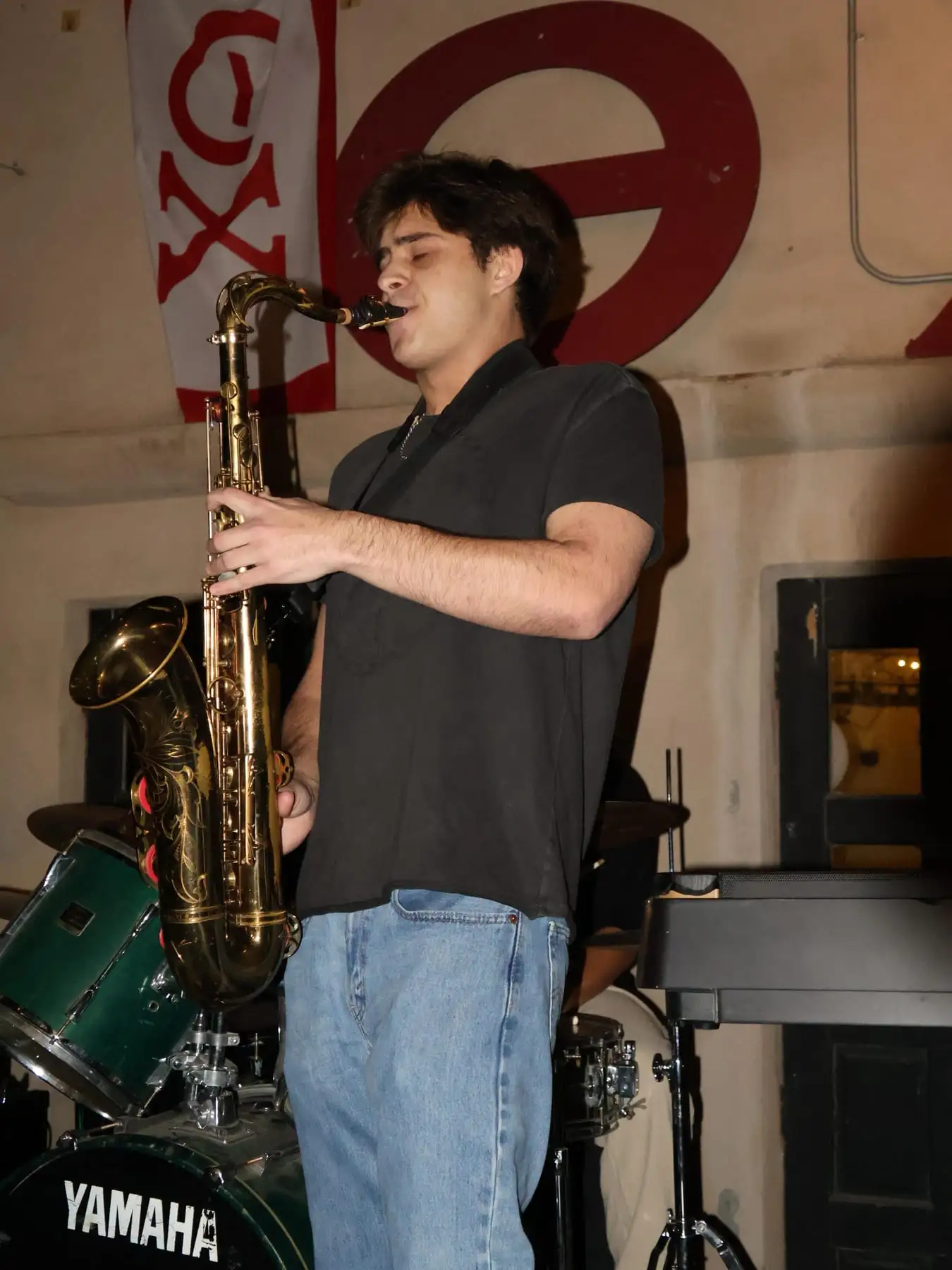 A saxophone solo on stage at the house show