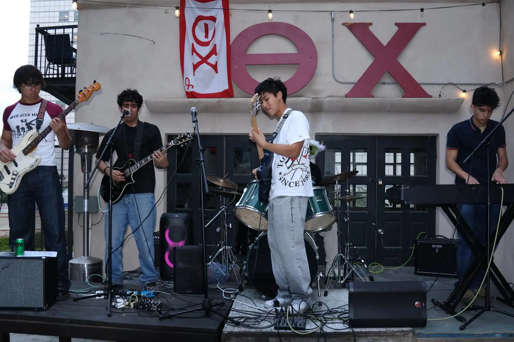 The band playing an outdoor stage set
