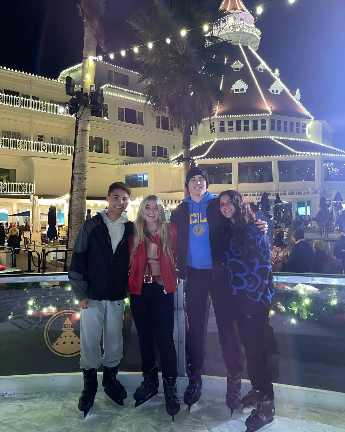The group ice skating at the Coronado rink