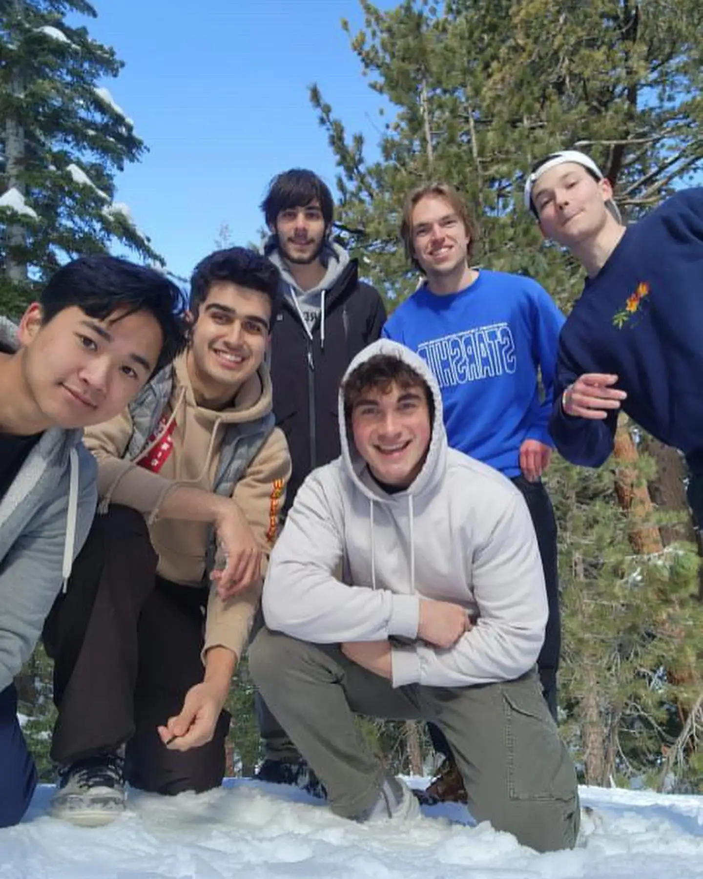 snow trip group crouch